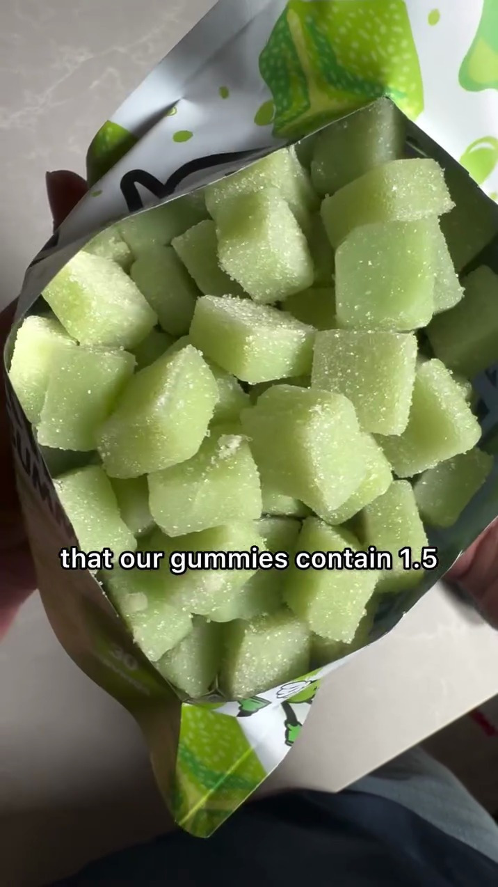 Open pouch of green gummies, overhead